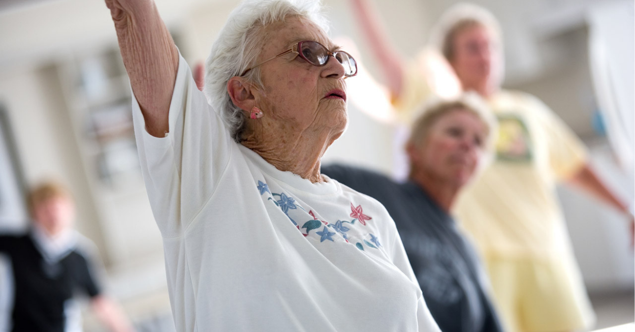 Senior woman in exercise class