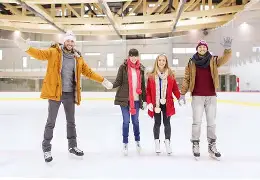 Adults skating on ice 