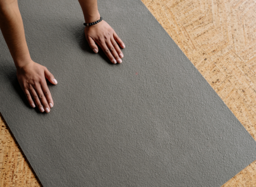 hands on a yoga mat