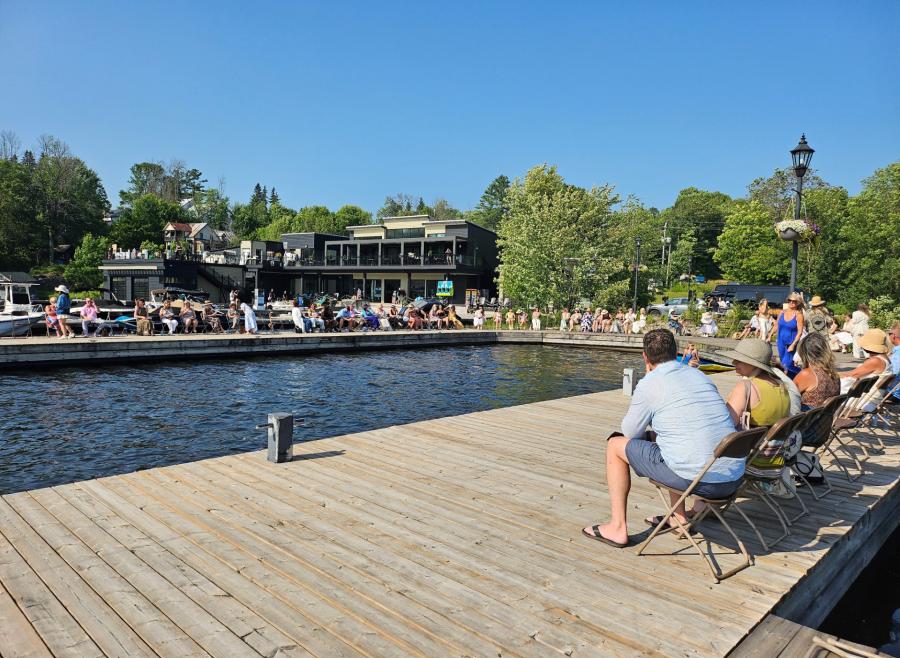 People on dock sitting in chairs in summer