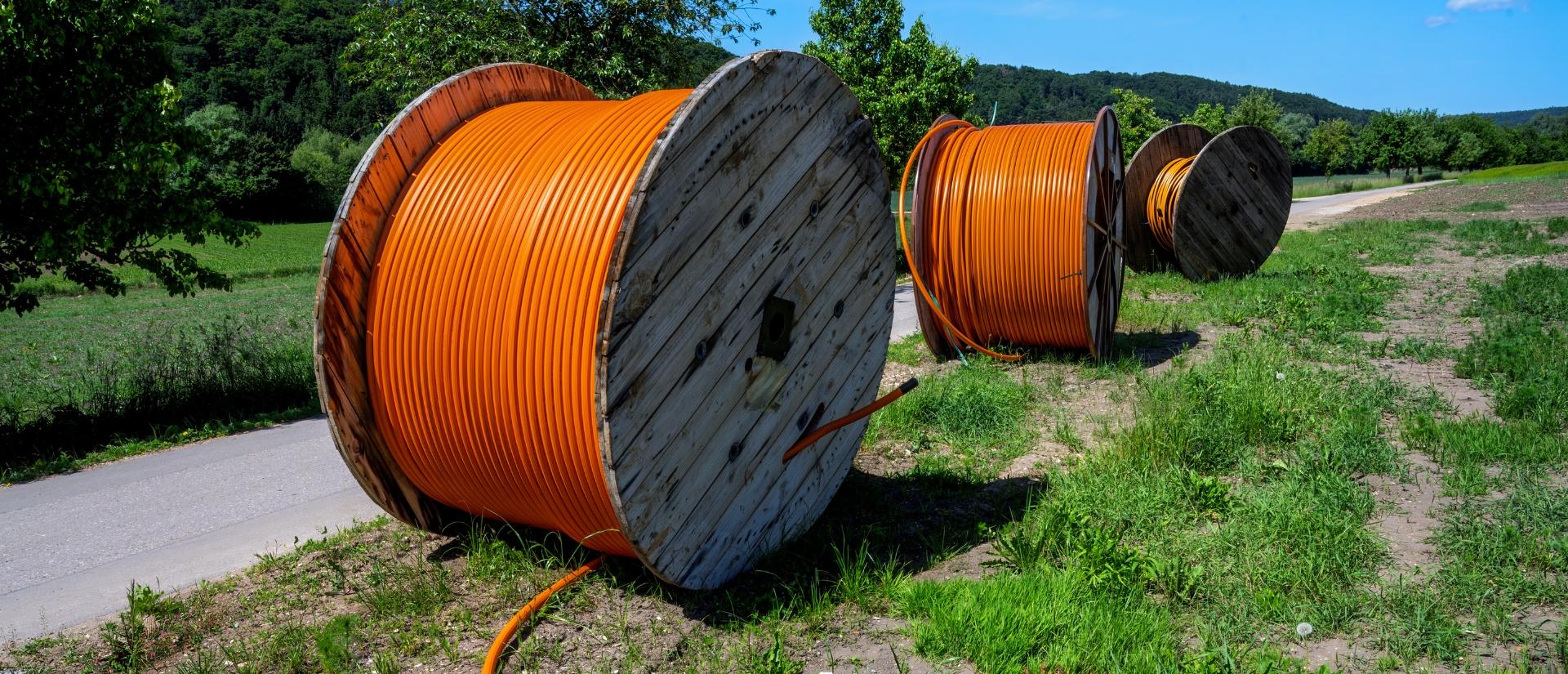 Three fiber optic cable rolls for broadband internet