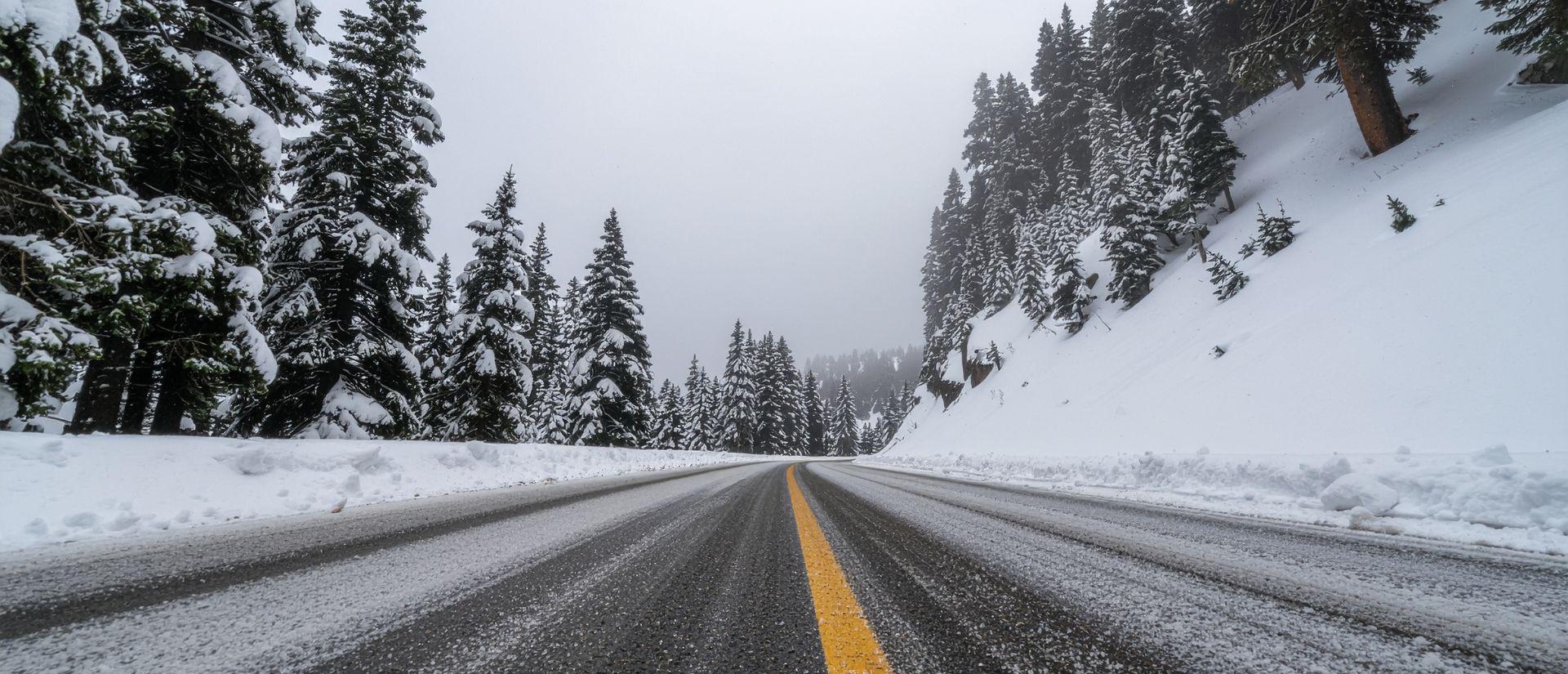  Scan My Site Free See how it works Click to select or drop a new image  Use setting  Optional  A two-lane road runs through a snowy forest landscape with snow-covered trees and overcast sky